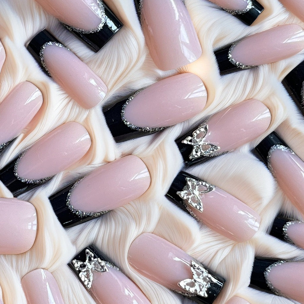 Glamouröse Stiletto-Nagelerweiterungen mit Schmetterlingsakzenten Karnz
