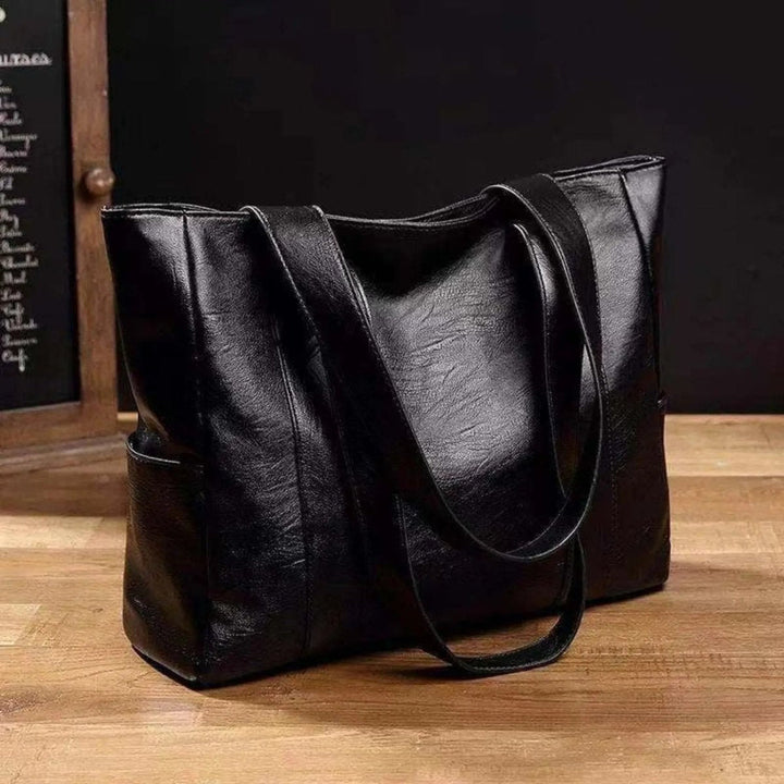 Elegante Schultertasche aus Leder im Retro-Stil mit glatter Oberfläche