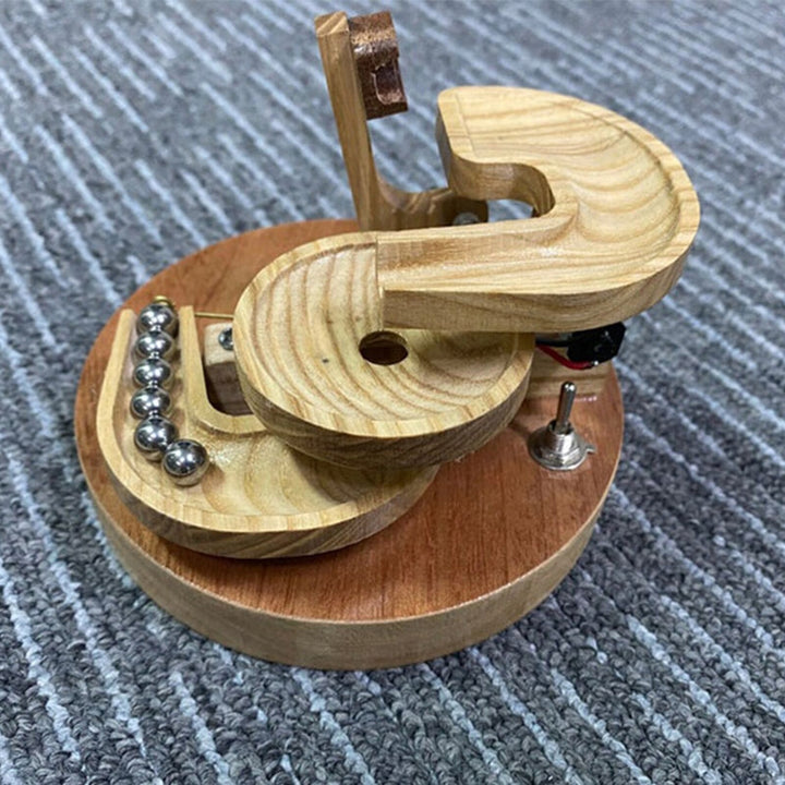 Karnz | Ewige Bewegung Holz-Marmor Maschine