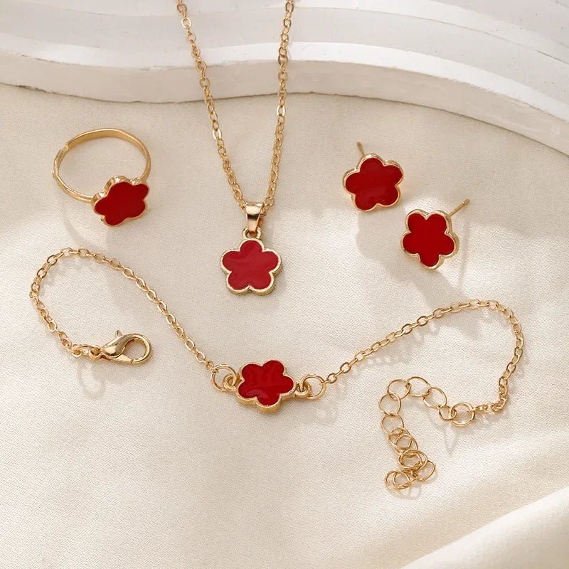 Karnz | Zierliches Glücksblatt Blumen Anhänger, Armband, Ohrringe und Ringe Set