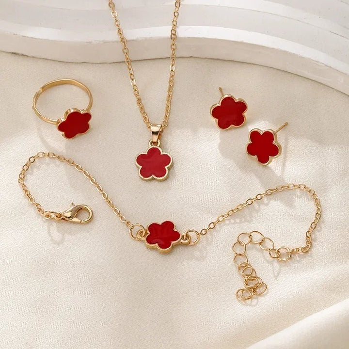 Karnz | Zierliches Glücksblatt Blumen Anhänger, Armband, Ohrringe und Ringe Set