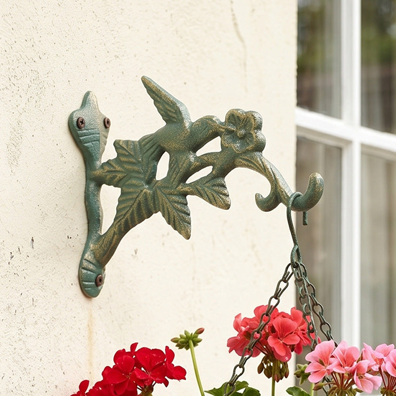 Gusseiserner Wandhaken mit Vogelmotiv