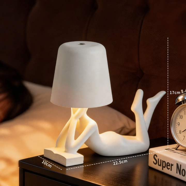 Moderne Tischlampe mit liegender Figurenform