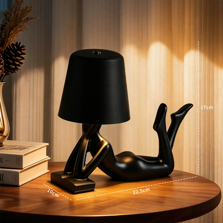 Moderne Tischlampe mit liegender Figurenform