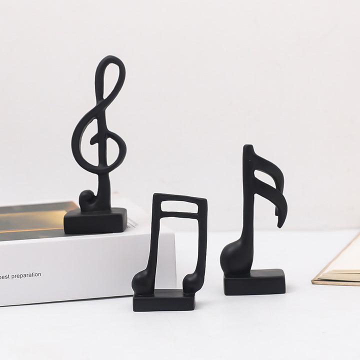 Drei Musiknoten-Figuren, Kunstharz, modern