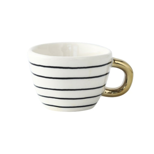 Tasse mit abstraktem geometrischen Muster und goldenem Henkel