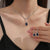 Karnz | Schimmernde blaue Tropfen-Diamant-Halskette und Ohrringe Set
